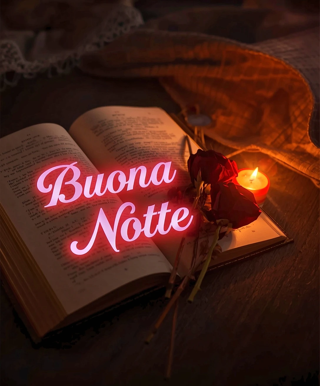 Dolce buonanotte immagini nuove: libro aperto sul tavolo con rosa rossa e candela accesa